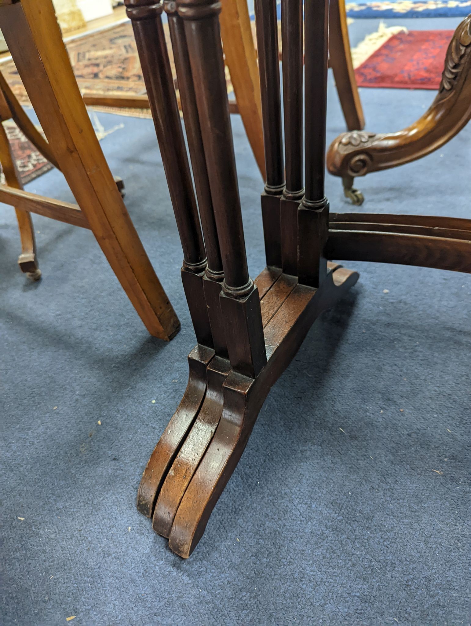 A nest of three Amboyna banded rectangular mahogany tea tables, width 48cm, depth 34cm, height 74cm